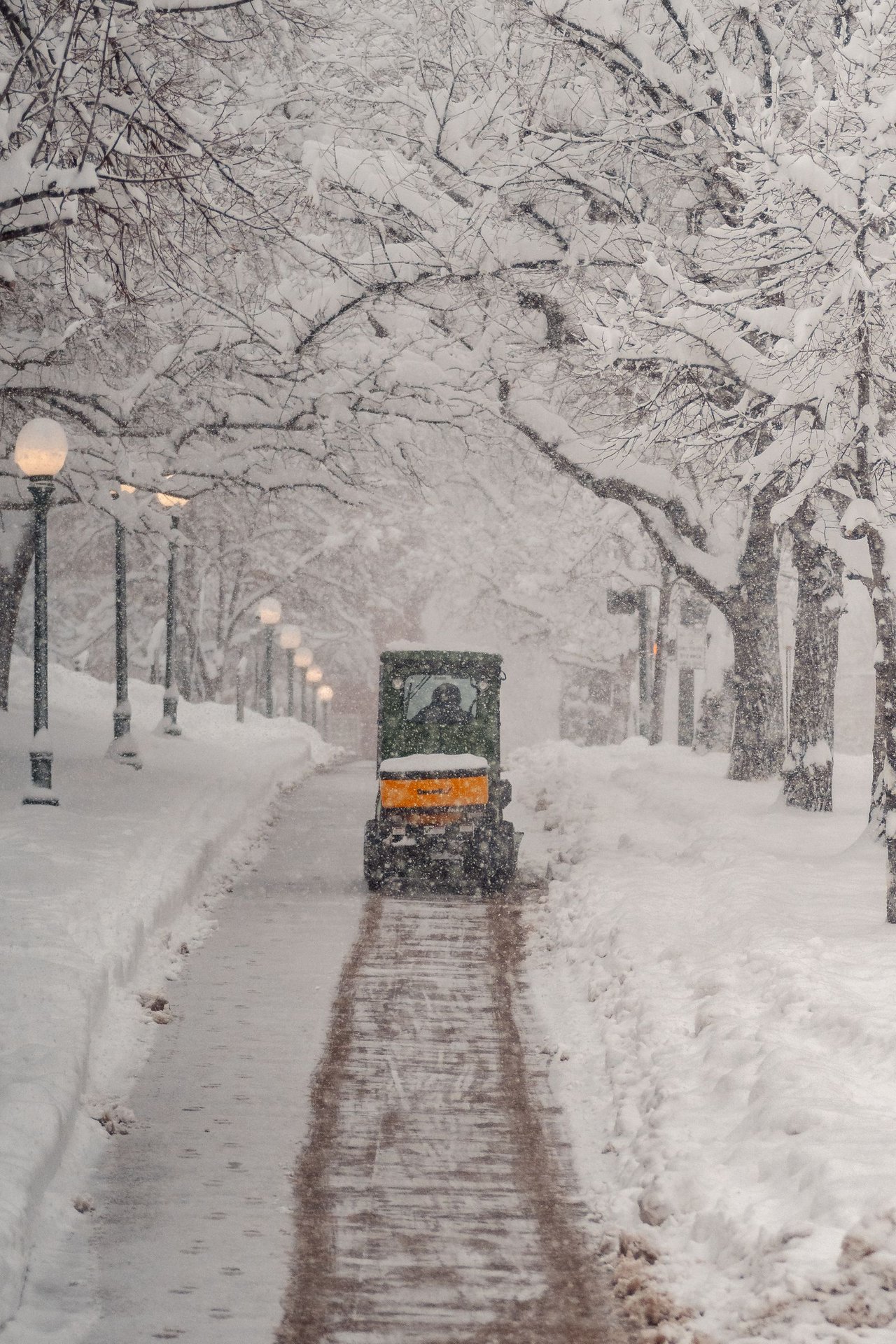 Snow being cleared from a pavement in Denver, Colorado