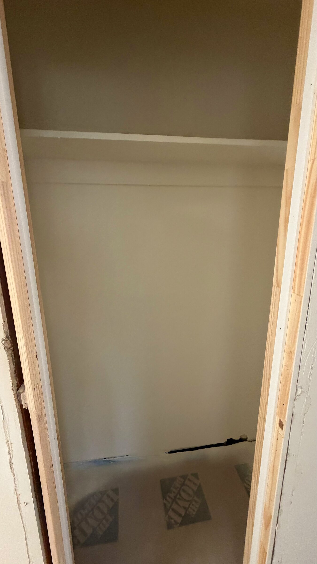 Bedroom closet freshly framed and prepped, ready for shelving