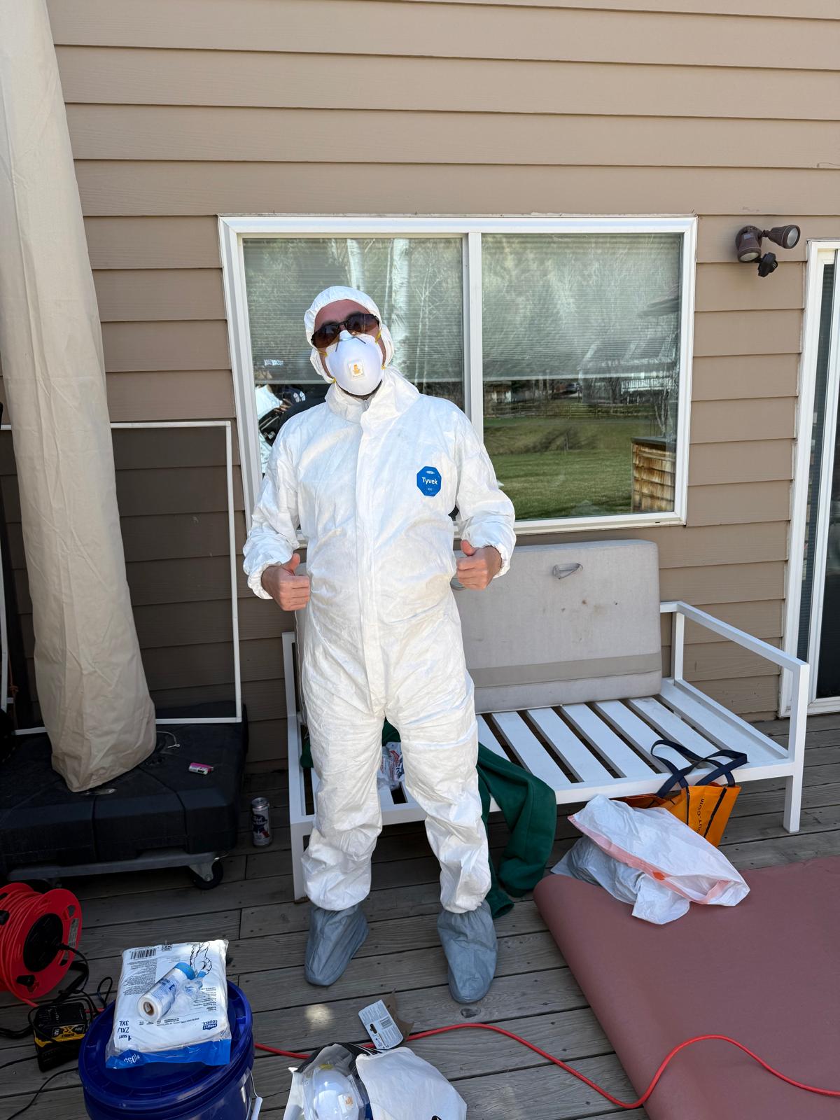 Denver Handy Co. technician in full protective gear before a dust-heavy prep job