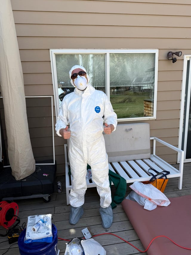 Denver Handy Co. technician in full protective gear before a dust-heavy prep job
